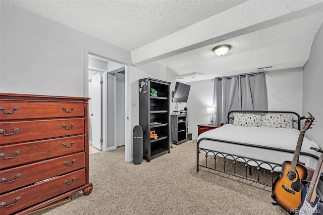 bedroom featuring light carpet, a textured ceiling, and baseboards