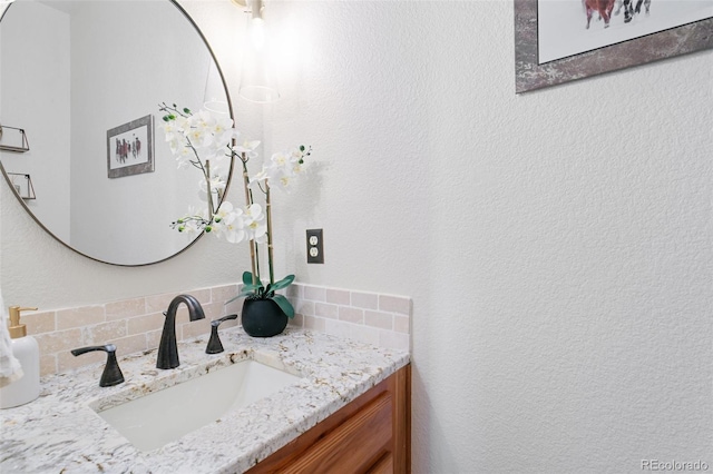 2467 Spanish Oak Ter, Colorado Springs, CO 80920 - bathroom with vanity and decorative backsplash