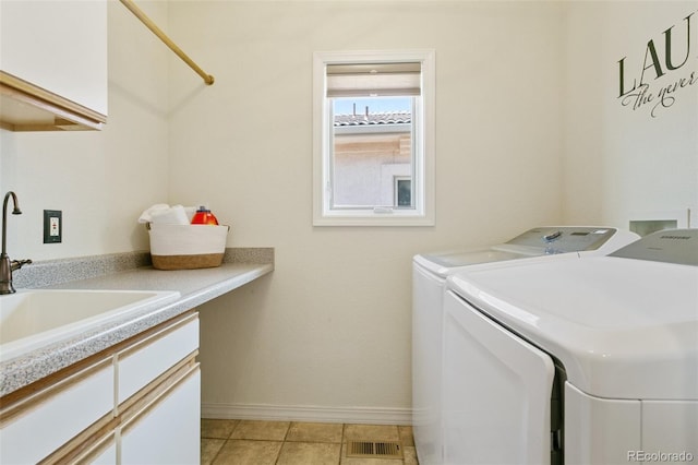 2467 Spanish Oak Ter, Colorado Springs, CO 80920 - washroom featuring independent washer and dryer and cabinet space
