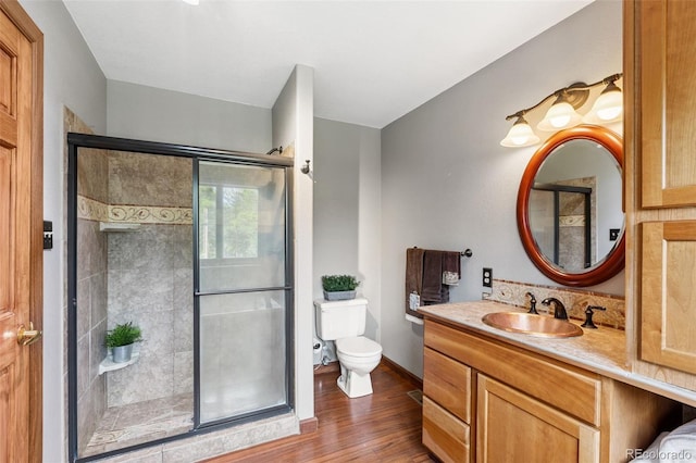 10668 Crystal Way, Morrison, CO 80465 - bathroom featuring wood finished floors, vanity, and a shower stall