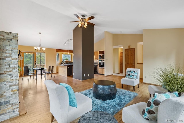 10668 Crystal Way, Morrison, CO 80465 - living area with a chandelier, ceiling fan, light wood-style flooring, and high vaulted ceiling