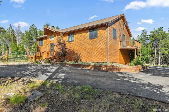 10668 Crystal Way, Morrison, CO 80465 - view of side of property with a wooden deck