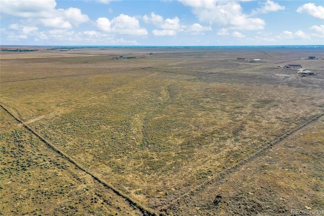 birds eye view of property with a rural view