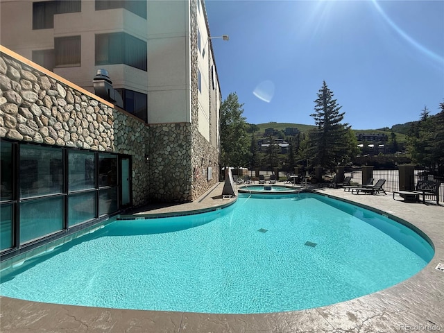 6 Emmons Rd Unit 379/381, Mount Crested Butte, CO 81225 - community pool featuring a community hot tub and a patio