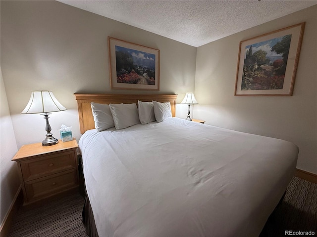 6 Emmons Rd Unit 379/381, Mount Crested Butte, CO 81225 - bedroom featuring a textured ceiling and dark colored carpet