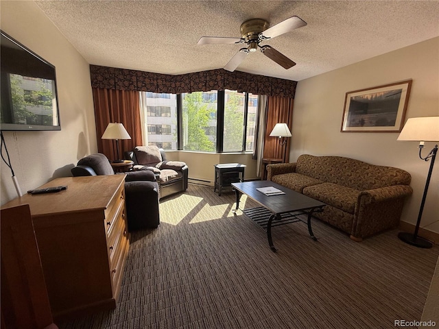 6 Emmons Rd Unit 379/381, Mount Crested Butte, CO 81225 - living area featuring a textured ceiling, ceiling fan, dark colored carpet, and a baseboard heating unit