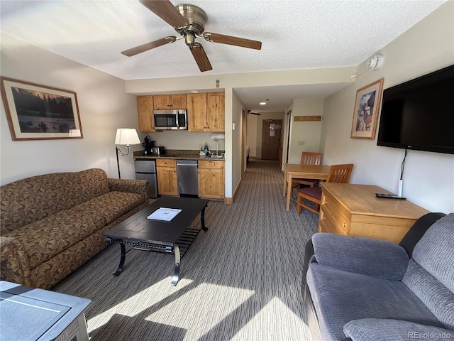 6 Emmons Rd Unit 379/381, Mount Crested Butte, CO 81225 - living room featuring dark carpet and ceiling fan