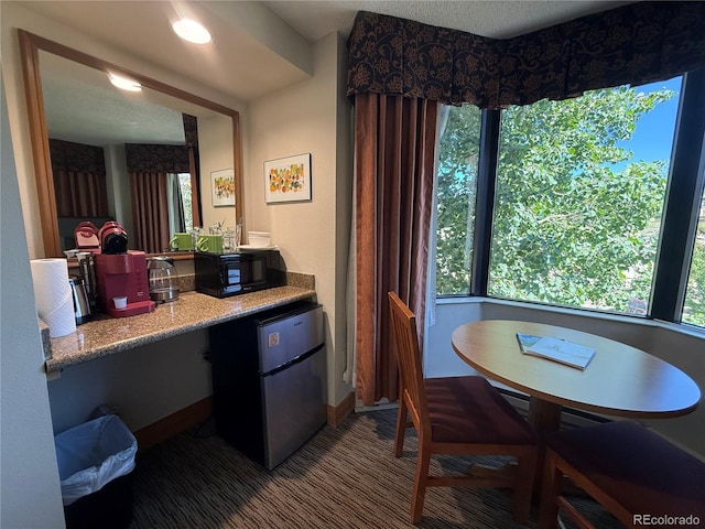 6 Emmons Rd Unit 379/381, Mount Crested Butte, CO 81225 - carpeted dining area featuring healthy amount of natural light