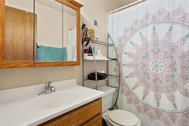 full bathroom with vanity and toilet