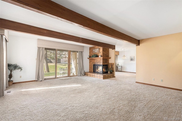 3103 Broadmoor Valley Rd Unit B, Colorado Springs, CO 80906 - unfurnished living room with beamed ceiling, baseboards, carpet flooring, and a fireplace