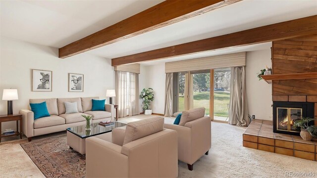 3103 Broadmoor Valley Rd Unit B, Colorado Springs, CO 80906 - living room featuring a fireplace, beamed ceiling, and carpet floors