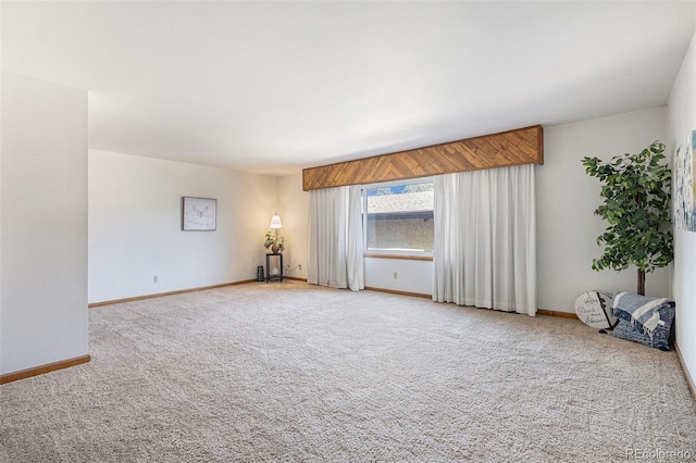3103 Broadmoor Valley Rd Unit B, Colorado Springs, CO 80906 - unfurnished living room with baseboards and carpet floors