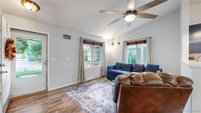 1750 Clark Dr, Erie, CO 80516 - living room featuring vaulted ceiling, wood finished floors, and ceiling fan