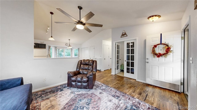 1750 Clark Dr, Erie, CO 80516 - living area with lofted ceiling, ceiling fan, wood finished floors, and french doors