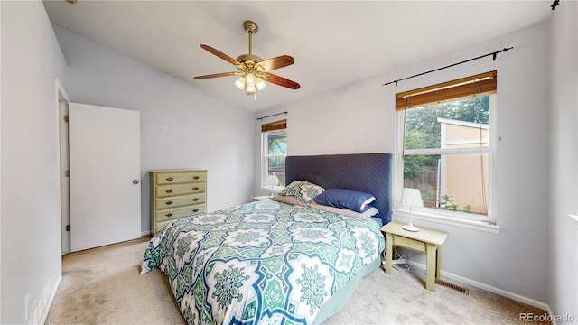 1750 Clark Dr, Erie, CO 80516 - carpeted bedroom with multiple windows, lofted ceiling, and a ceiling fan