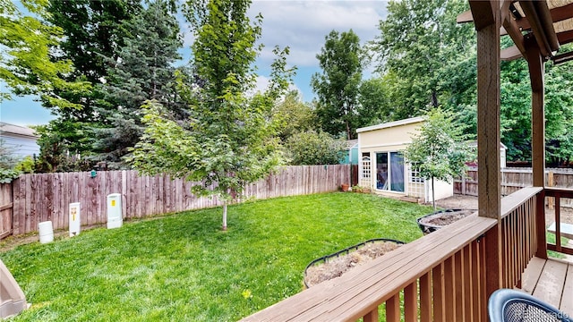 1750 Clark Dr, Erie, CO 80516 - fenced backyard featuring an outdoor structure and a deck