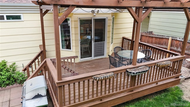 1750 Clark Dr, Erie, CO 80516 - wooden deck with outdoor dining space and a pergola