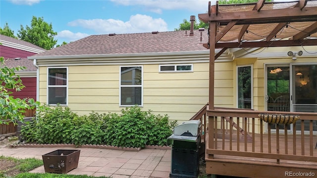 1750 Clark Dr, Erie, CO 80516 - back of house featuring a shingled roof, a pergola, and a wooden deck