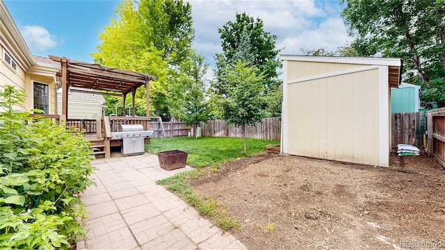 1750 Clark Dr, Erie, CO 80516 - fenced backyard with a storage unit, a pergola, a deck, an outdoor fire pit, and a patio area
