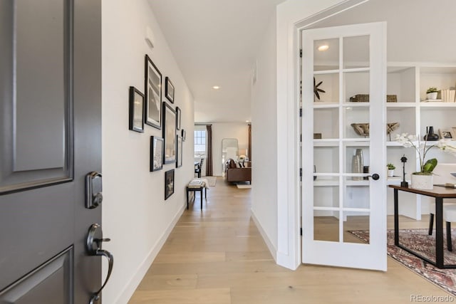 hallway with light wood-type flooring