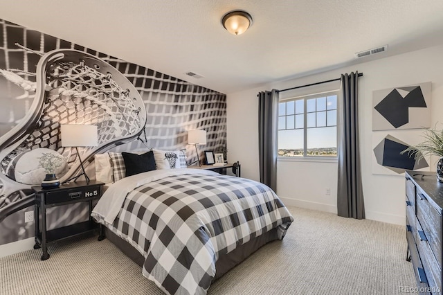 carpeted bedroom featuring a textured ceiling