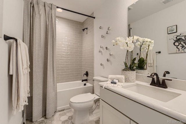 full bathroom featuring shower / bath combo, vanity, and toilet