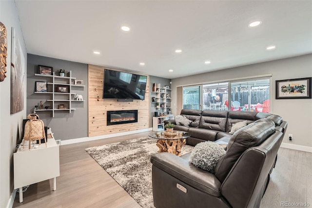 1025 Zang St, Golden, CO 80401 - living area featuring baseboards, a fireplace, recessed lighting, and wood finished floors