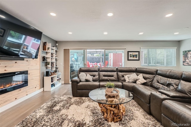 1025 Zang St, Golden, CO 80401 - living room with recessed lighting, a glass covered fireplace, and wood finished floors