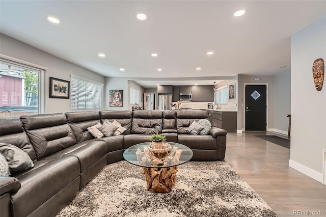 1025 Zang St, Golden, CO 80401 - living area featuring recessed lighting, baseboards, and light wood-style floors