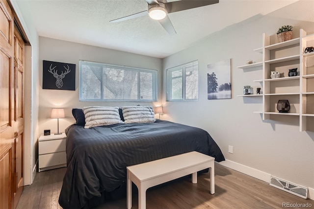 1025 Zang St, Golden, CO 80401 - bedroom featuring baseboards, ceiling fan, wood finished floors, and visible vents