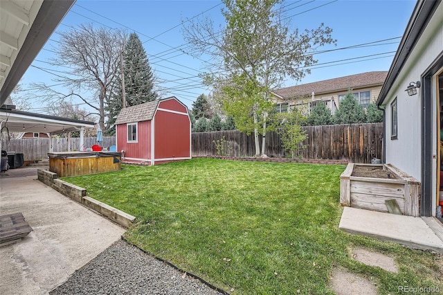1025 Zang St, Golden, CO 80401 - view of yard featuring a fenced backyard, an outdoor structure, a hot tub, and a patio area