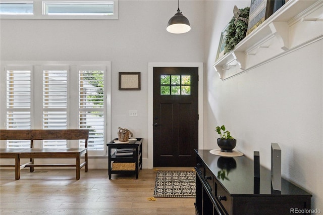 7440 Quail St, Arvada, CO 80005 - entrance foyer featuring light wood finished floors and a high ceiling