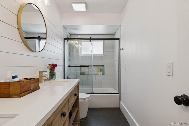 7440 Quail St, Arvada, CO 80005 - full bath with double vanity and shower / bath combination with glass door