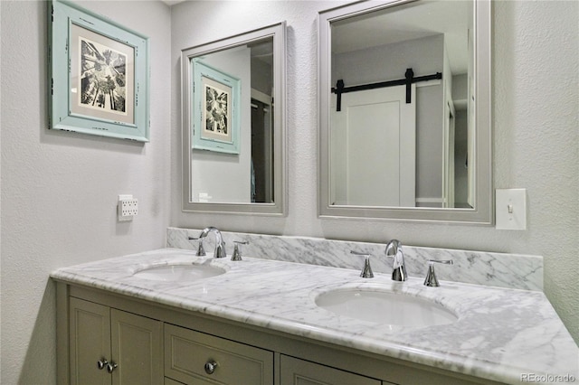 7440 Quail St, Arvada, CO 80005 - full bath featuring double vanity and a textured wall