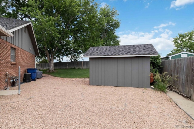7440 Quail St, Arvada, CO 80005 - fenced backyard featuring a storage unit