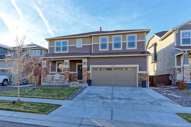 view of front of home featuring a garage and a front lawn