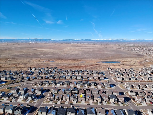 drone / aerial view featuring a mountain view