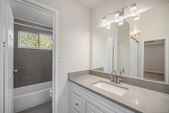 1403 Valentia St, Denver, CO 80220 - bathroom featuring vanity and tub / shower combination