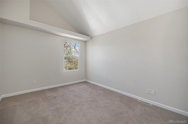 1403 Valentia St, Denver, CO 80220 - empty room featuring carpet floors and vaulted ceiling