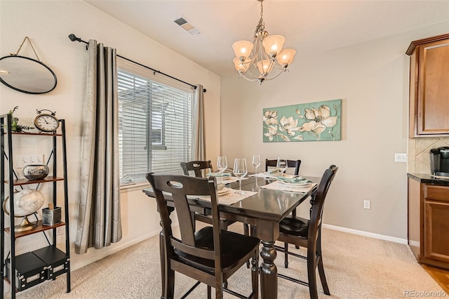 13151 Grant Cir N Unit C, Thornton, CO 80241 - dining space with a chandelier and baseboards