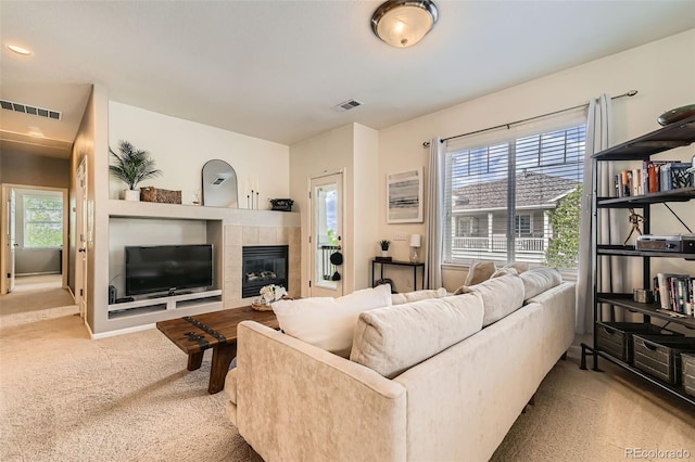 13151 Grant Cir N Unit C, Thornton, CO 80241 - living area featuring carpet floors and a tile fireplace