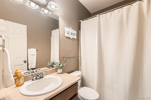 13151 Grant Cir N Unit C, Thornton, CO 80241 - full bath with toilet, vanity, and a textured wall