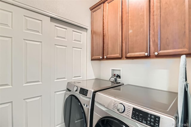 13151 Grant Cir N Unit C, Thornton, CO 80241 - laundry area with cabinet space and washer and clothes dryer