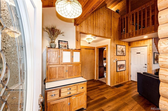 7573 Pine Crest Dr, Kiowa, CO 80117 - entrance foyer with dark wood-type flooring, wooden walls, and wooden ceiling
