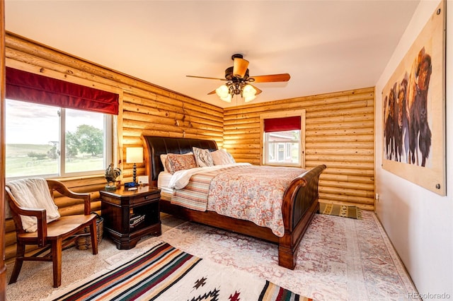 7573 Pine Crest Dr, Kiowa, CO 80117 - bedroom featuring log walls and ceiling fan