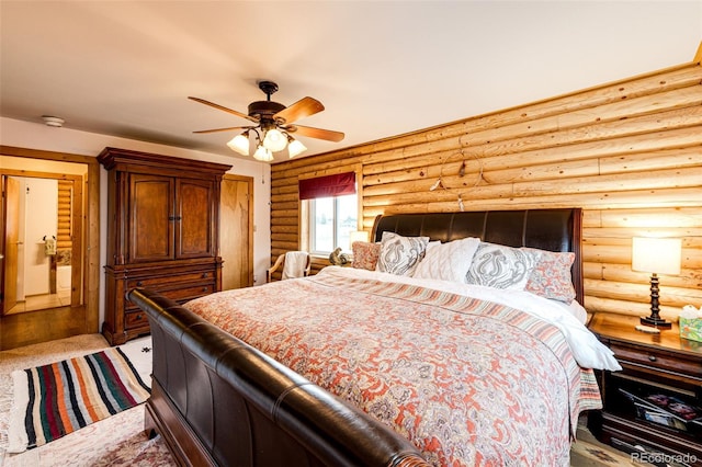 7573 Pine Crest Dr, Kiowa, CO 80117 - bedroom featuring log walls and ceiling fan