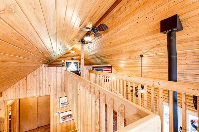 7573 Pine Crest Dr, Kiowa, CO 80117 - stairway featuring wood walls, wooden ceiling, lofted ceiling, and a ceiling fan