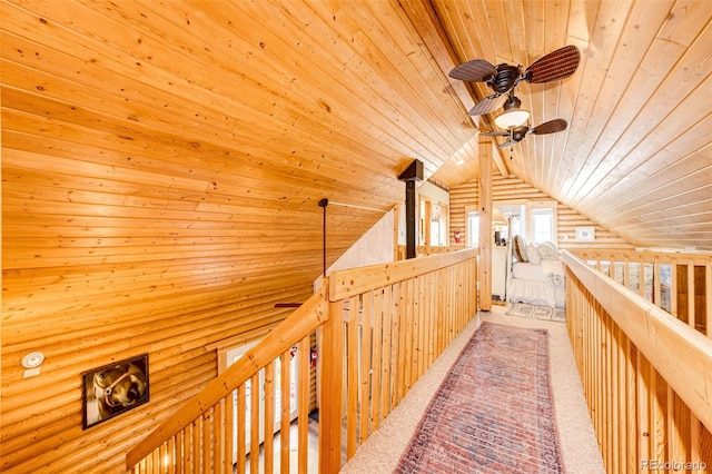 7573 Pine Crest Dr, Kiowa, CO 80117 - hall featuring wood ceiling, lofted ceiling, an upstairs landing, and carpet floors