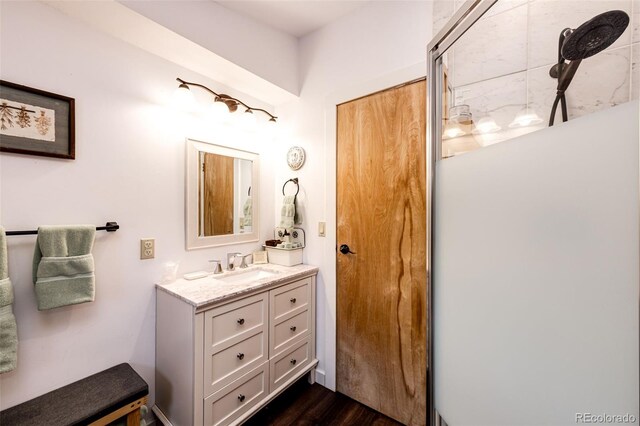 7573 Pine Crest Dr, Kiowa, CO 80117 - bathroom with vanity and wood finished floors