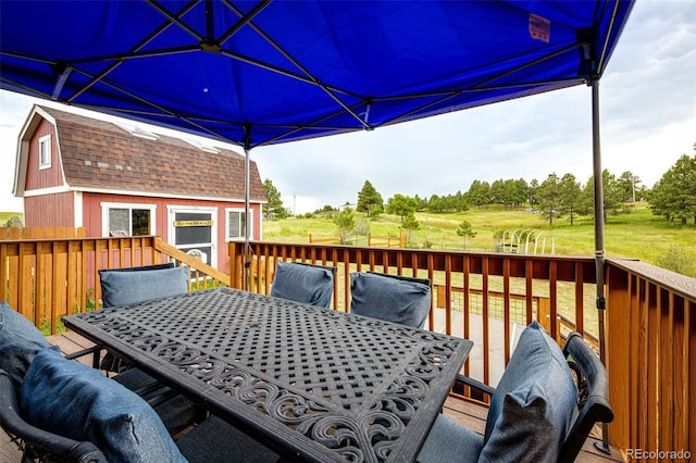 7573 Pine Crest Dr, Kiowa, CO 80117 - deck featuring outdoor dining area and an outdoor structure